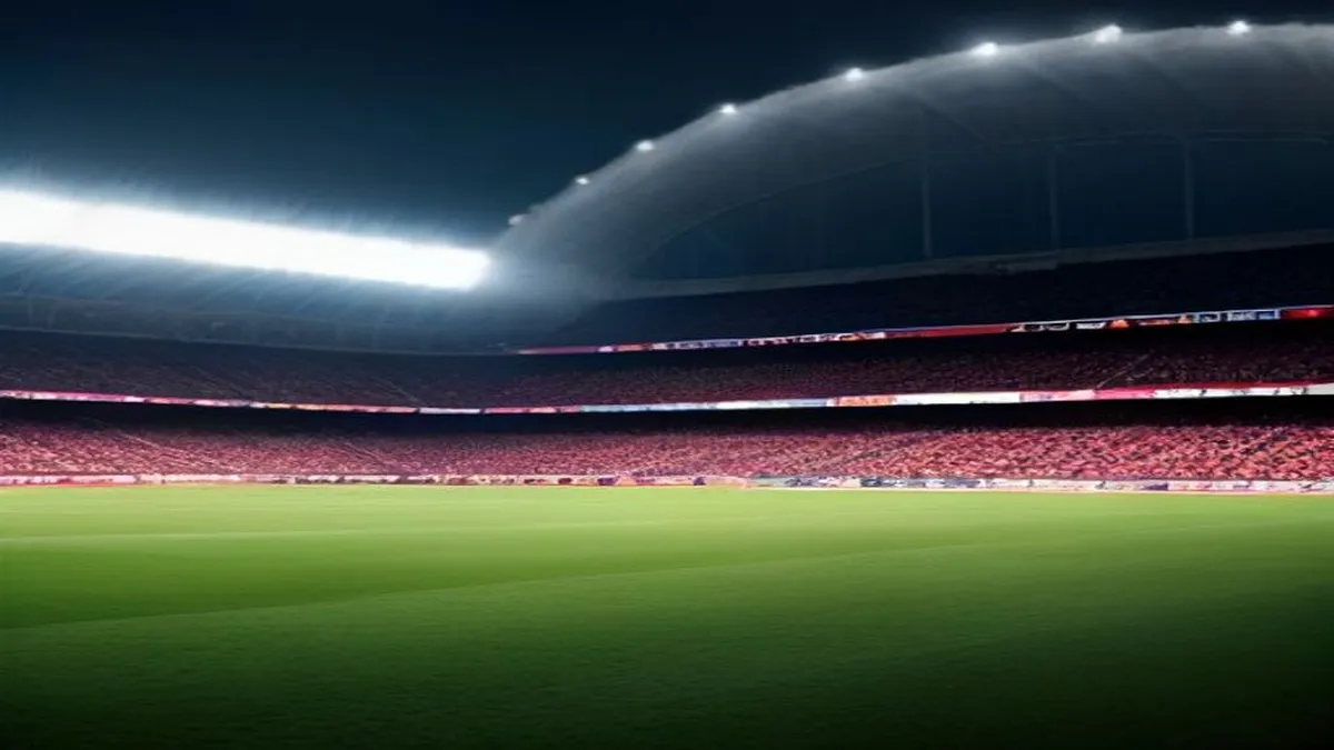 A soccer player in action, with a stadium full of fans in the background